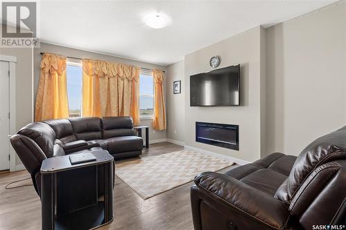 3339 Green Turtle Road, Regina, SK - Indoor Photo Showing Living Room With Fireplace