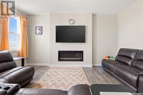 3339 Green Turtle Road, Regina, SK - Indoor Photo Showing Living Room With Fireplace