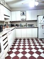 Kitchen featuring tile flooring - 