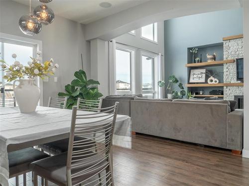 30 Angela Everts Drive, Winnipeg, MB - Indoor Photo Showing Dining Room With Fireplace