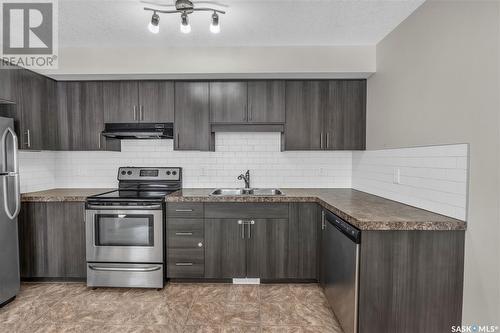 2-5294 Aerodrome Road, Regina, SK - Indoor Photo Showing Kitchen With Stainless Steel Kitchen With Double Sink With Upgraded Kitchen