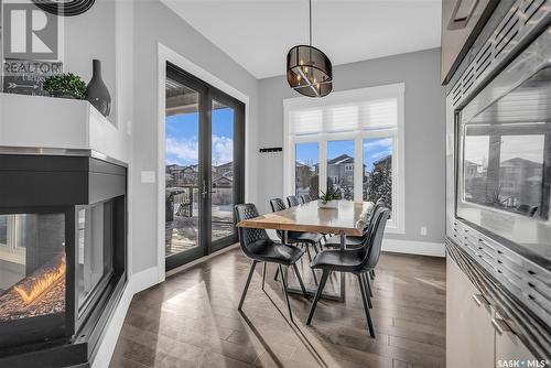 106 Werschner Crescent, Saskatoon, SK - Indoor Photo Showing Dining Room With Fireplace