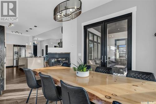 106 Werschner Crescent, Saskatoon, SK - Indoor Photo Showing Dining Room With Fireplace