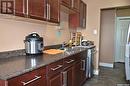 12 2112 Ste Cecilia Avenue, Saskatoon, SK  - Indoor Photo Showing Kitchen With Double Sink 