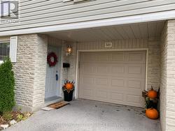 Main entrance to garage and front door - 