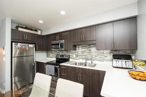 709 280 Amber Trail, Winnipeg, MB - Indoor Photo Showing Kitchen With Stainless Steel Kitchen With Double Sink With Upgraded Kitchen