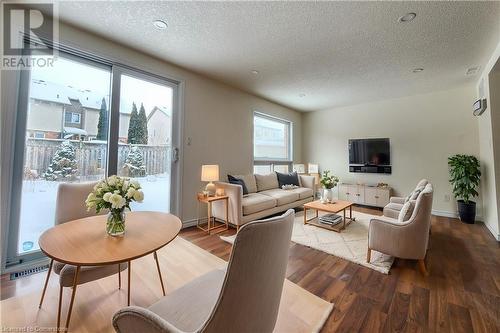 Virtually staged - 39 Bridlewreath Street, Kitchener, ON - Indoor Photo Showing Living Room