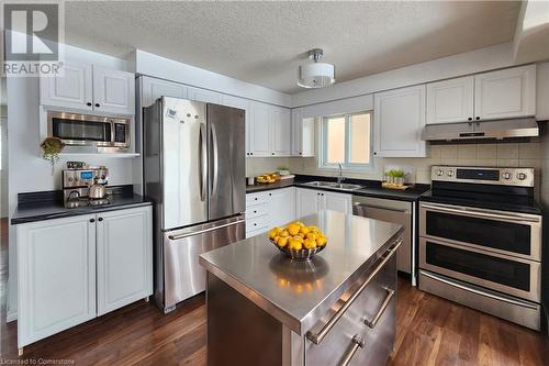 Virtually staged - 39 Bridlewreath Street, Kitchener, ON - Indoor Photo Showing Kitchen With Double Sink