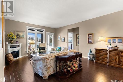 205 4721 Mctavish Street, Regina, SK - Indoor Photo Showing Living Room With Fireplace