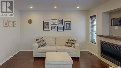 101 4100 Sandhill Crescent, Regina, SK - Indoor Photo Showing Living Room With Fireplace