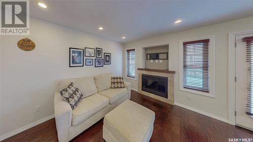 101 4100 Sandhill Crescent, Regina, SK - Indoor Photo Showing Living Room With Fireplace