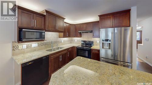 101 4100 Sandhill Crescent, Regina, SK - Indoor Photo Showing Kitchen With Double Sink