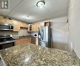 20 2620 5Th Avenue N, Regina, SK  - Indoor Photo Showing Kitchen With Stainless Steel Kitchen With Double Sink 