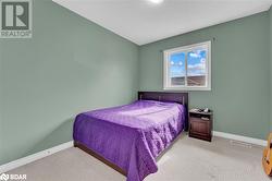 Bedroom featuring light carpet - 