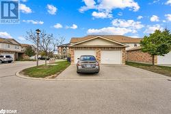 View of front of property with a garage - 