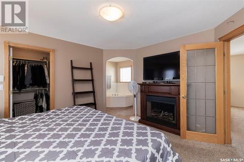 223 Beerling Crescent, Saskatoon, SK - Indoor Photo Showing Bedroom With Fireplace