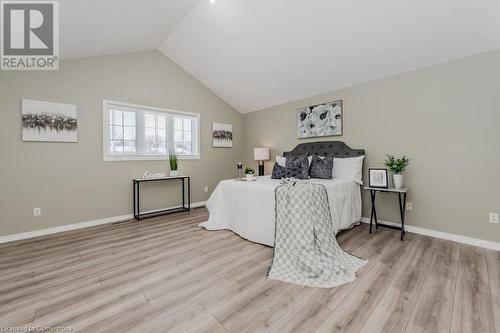 Bedroom featuring vaulted ceiling and light hardwood / wood-style floors - 66 Karen Walk, Waterloo, ON - Indoor Photo Showing Bedroom