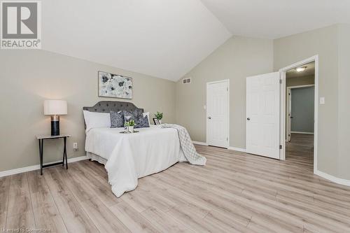 Bedroom featuring vaulted ceiling and light hardwood / wood-style floors - 66 Karen Walk, Waterloo, ON - Indoor Photo Showing Bedroom