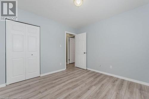 Unfurnished bedroom featuring a closet and light wood-type flooring - 66 Karen Walk, Waterloo, ON - Indoor Photo Showing Other Room