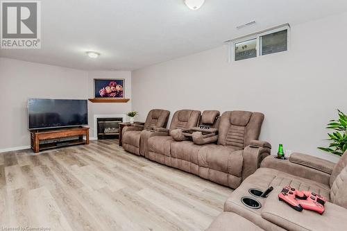 Living room with light hardwood / wood-style flooring - 66 Karen Walk, Waterloo, ON - Indoor Photo Showing Living Room With Fireplace