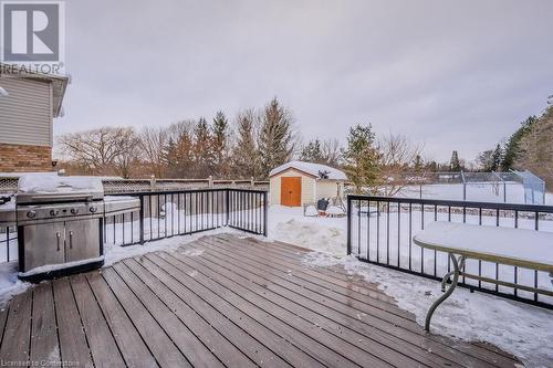 Snow covered deck featuring a shed - 66 Karen Walk, Waterloo, ON - Outdoor With Exterior