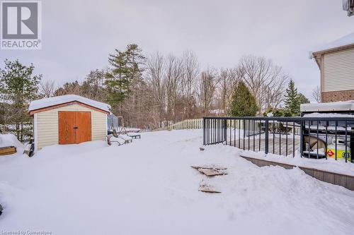 Snowy yard featuring a storage shed - 66 Karen Walk, Waterloo, ON - Outdoor With Exterior