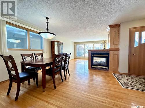 417 East Place, Saskatoon, SK - Indoor Photo Showing Dining Room With Fireplace