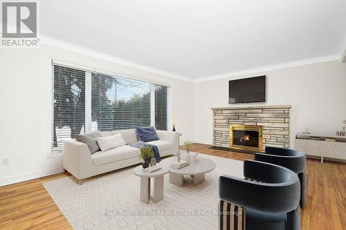 Virtually Staged - 386 Billings Avenue, Ottawa, ON - Indoor Photo Showing Living Room With Fireplace