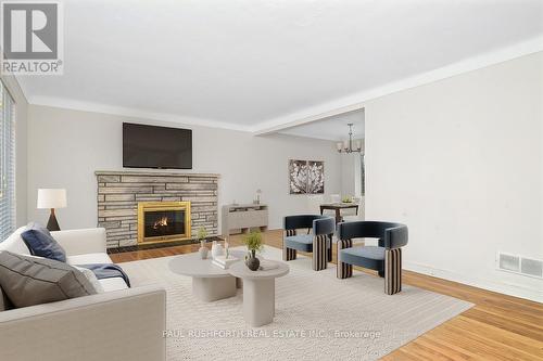 Virtually Staged - 386 Billings Avenue, Ottawa, ON - Indoor Photo Showing Living Room With Fireplace