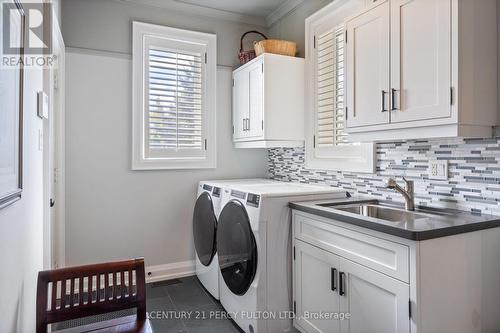 Main-floor Laundry with garage access - 990 John Watt Boulevard, Mississauga, ON - Indoor Photo Showing Laundry Room