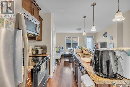 5402 Mitchinson Way, Regina, SK - Indoor Photo Showing Kitchen With Stainless Steel Kitchen With Double Sink With Upgraded Kitchen