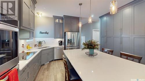 7033 Maple Fern Bay, Regina, SK - Indoor Photo Showing Kitchen With Double Sink With Upgraded Kitchen