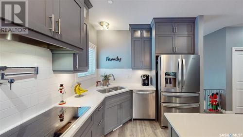 7033 Maple Fern Bay, Regina, SK - Indoor Photo Showing Kitchen With Double Sink With Upgraded Kitchen