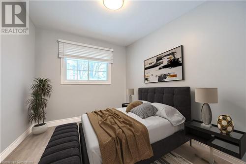 Bedroom featuring light wood-type flooring - 82 Conway Drive, Kitchener, ON - Indoor Photo Showing Bedroom