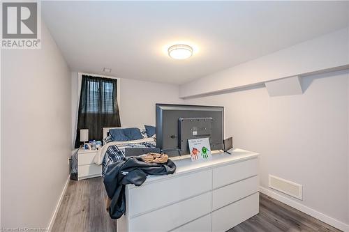 Bedroom featuring wood-type flooring - 82 Conway Drive, Kitchener, ON - Indoor Photo Showing Bedroom