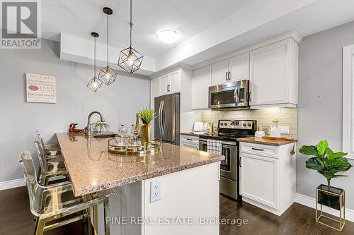 110 - 8475 Wyandotte Street E, Windsor, ON - Indoor Photo Showing Kitchen With Stainless Steel Kitchen With Upgraded Kitchen