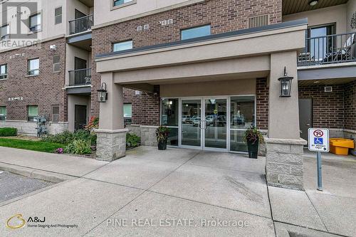 110 - 8475 Wyandotte Street E, Windsor, ON - Outdoor With Balcony With Facade