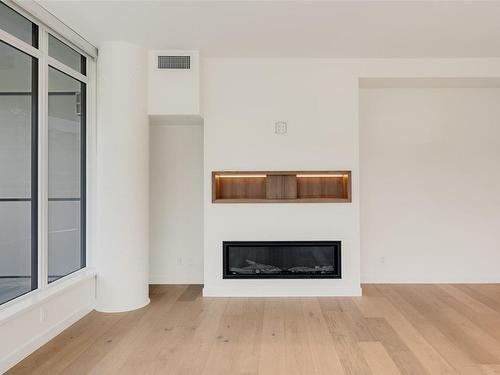 715-2000 Hannington Rd, Langford, BC - Indoor Photo Showing Living Room With Fireplace