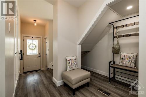 Front hall with powder room, inside access to garage, and closet. - 165 Crampton Drive, Carleton Place, ON - Indoor Photo Showing Other Room