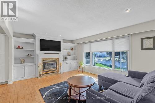 12 Roslyn Road, Barrie, ON - Indoor Photo Showing Living Room With Fireplace