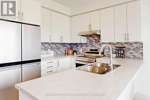 104 Edminston Drive, Centre Wellington, ON - Indoor Photo Showing Kitchen With Double Sink With Upgraded Kitchen