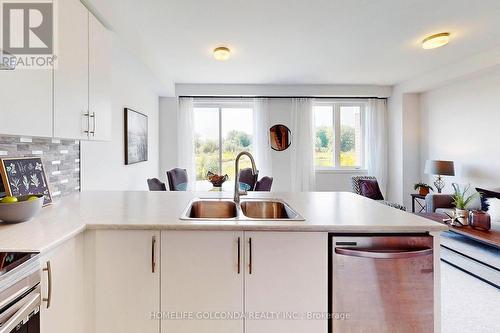 104 Edminston Drive, Centre Wellington, ON - Indoor Photo Showing Kitchen With Double Sink