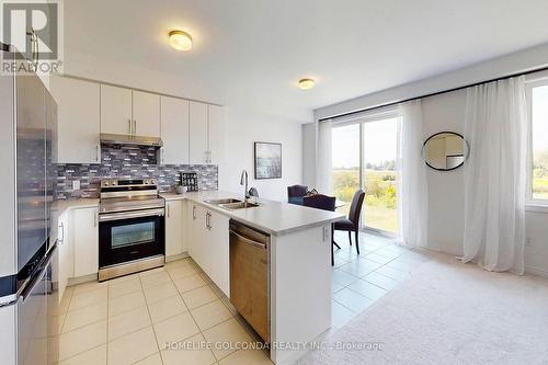 104 Edminston Drive, Centre Wellington, ON - Indoor Photo Showing Kitchen With Double Sink