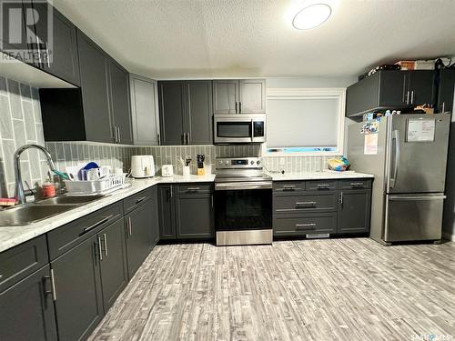 1041 110Th Street, North Battleford, SK - Indoor Photo Showing Kitchen With Double Sink