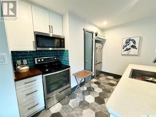 1041 110Th Street, North Battleford, SK - Indoor Photo Showing Kitchen With Double Sink