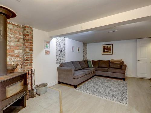 Salle familiale - 36 Rue Cartier, Saint-Jérôme, QC - Indoor Photo Showing Living Room With Fireplace