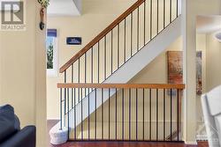 Contemporary staircase takes you to the upper and lower levels. - 