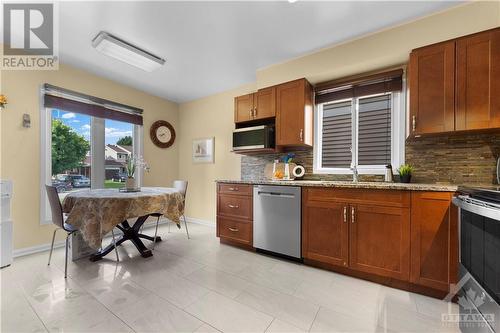 Sunny eat-in kitchen with picture window overlooking the front yard. - 17 Sovereign Avenue, Ottawa, ON - Indoor Photo Showing Kitchen