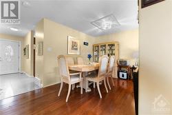 Spacious dining room perfect for hosting large family gatherings. - 