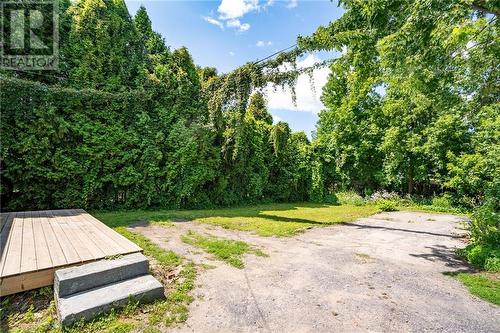 Backyard with deck perfect for bbqing or sitting outside and enjoying the fresh air. - 419 Water Street E, Cornwall, ON - Outdoor